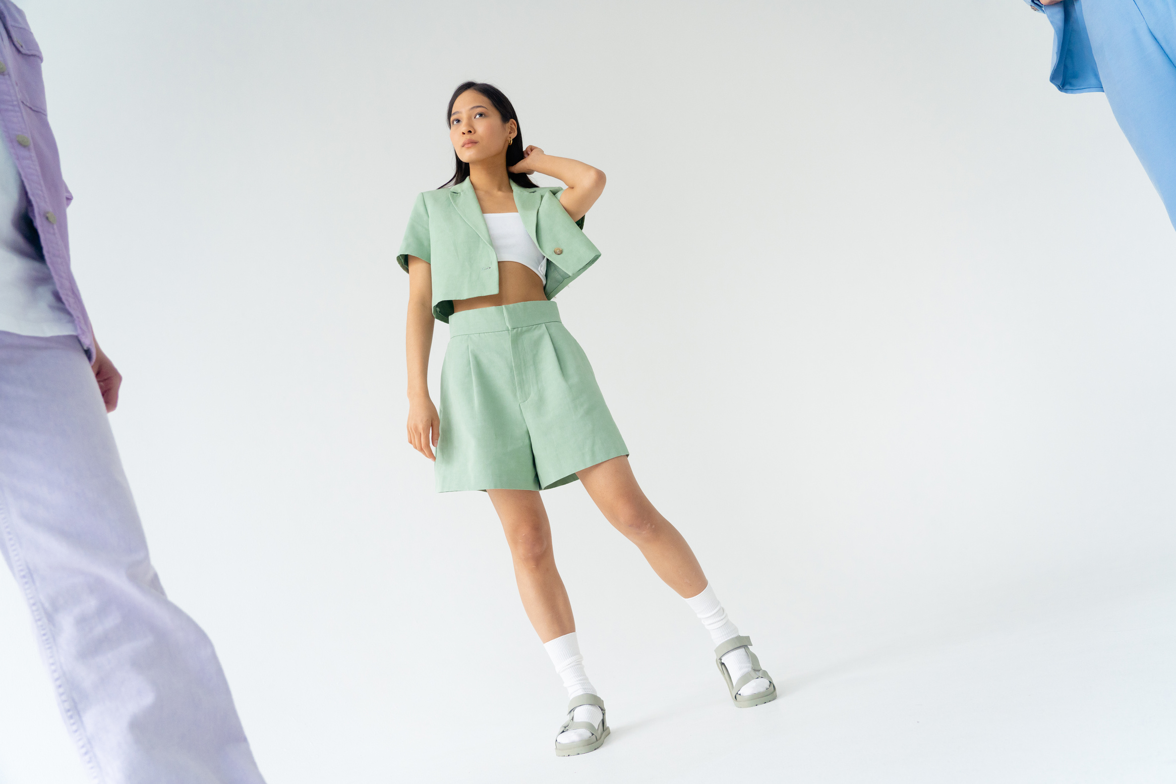 A Low Angle Shot of a Woman in Pastel Green Top and Shorts